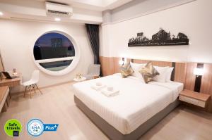 Voodi või voodid majutusasutuse The Space Hotel Chiang Rai toas