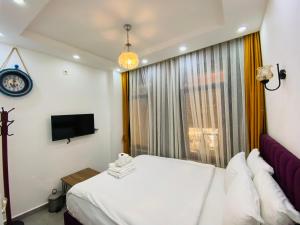 Postel nebo postele na pokoji v ubytování Galata Zade Luxury Boutique Hotel