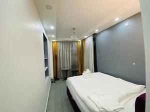 Postel nebo postele na pokoji v ubytování Galata Zade Luxury Boutique Hotel