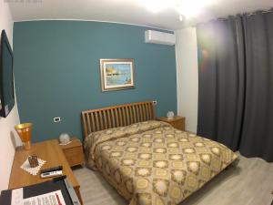 Postel nebo postele na pokoji v ubytování il Riccio B&B