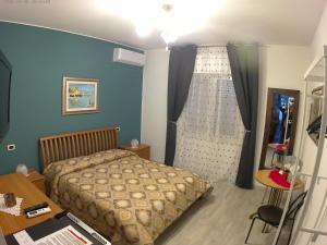 Postel nebo postele na pokoji v ubytování il Riccio B&B
