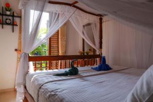 A bed or beds in a room at Cinnamon City
