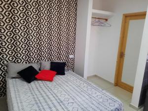 Rúm í herbergi á Guest House Maio
