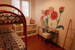Posteľ alebo postele v izbe v ubytovaní La casa degli oleandri