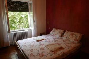 Posteľ alebo postele v izbe v ubytovaní La casa degli oleandri
