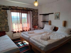 A bed or beds in a room at Casa Lambuh