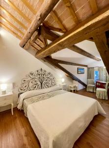 Postel nebo postele na pokoji v ubytování Ca' Settecento "Villa Cavazza Querini"