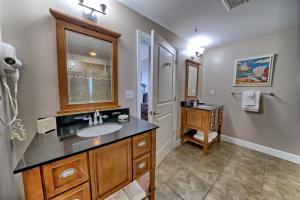 a bathroom with a sink and a mirror at PierPark 2BR Beachfront Luxury Condo w View Sterling Breeze Resorts in Panama City Beach