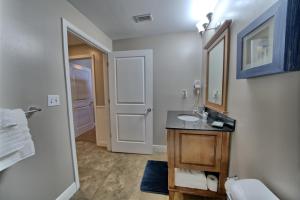 a bathroom with a sink and a mirror at PierPark 2BR Beachfront Luxury Condo w View Sterling Breeze Resorts in Panama City Beach