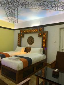 Un pat sau paturi într-o cameră la Hotel ABC, Boutique Hotel in Pokhara
