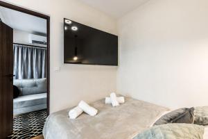Postel nebo postele na pokoji v ubytování Aparthome Tatra