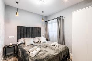 Postel nebo postele na pokoji v ubytování Aparthome Tatra