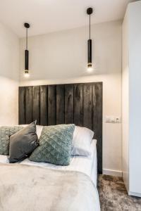 Postel nebo postele na pokoji v ubytování Aparthome Tatra