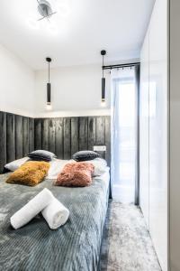 Postel nebo postele na pokoji v ubytování Aparthome Tatra