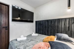 Postel nebo postele na pokoji v ubytování Aparthome Tatra