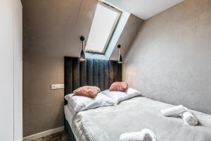 Postel nebo postele na pokoji v ubytování Aparthome Tatra