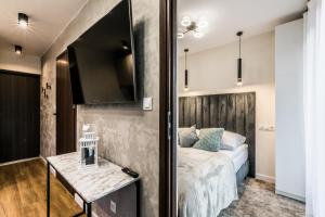 Postel nebo postele na pokoji v ubytování Aparthome Tatra