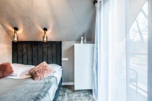 Postel nebo postele na pokoji v ubytování Aparthome Tatra