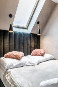 Postel nebo postele na pokoji v ubytování Aparthome Tatra