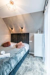 Postel nebo postele na pokoji v ubytování Aparthome Tatra