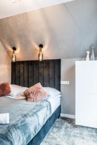 Postel nebo postele na pokoji v ubytování Aparthome Tatra