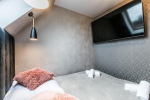 Postel nebo postele na pokoji v ubytování Aparthome Tatra