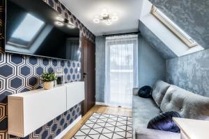 TV a/nebo společenská místnost v ubytování Aparthome Tatra