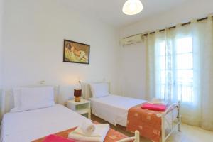 A bed or beds in a room at Villa Joanna