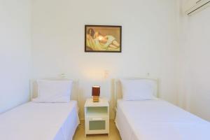 A bed or beds in a room at Villa Joanna