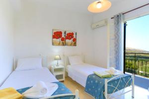 A bed or beds in a room at Villa Joanna