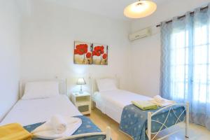A bed or beds in a room at Villa Joanna