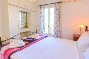 A bed or beds in a room at Villa Joanna
