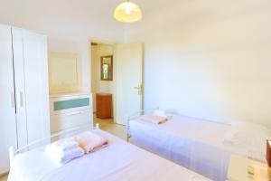 A bed or beds in a room at Villa Joanna