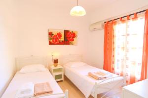 A bed or beds in a room at Villa Joanna