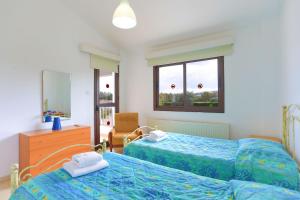 Tempat tidur dalam kamar di Villa Stavriella