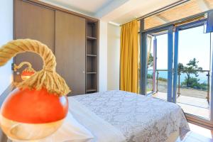 A bed or beds in a room at Kalma Villa Dio