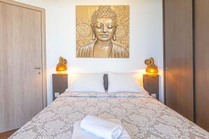 A bed or beds in a room at Kalma Villa Dio