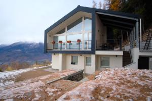 a house on the side of a mountain at Sérémont 534 in Charvensod