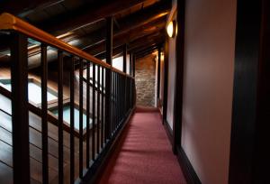 Säng eller sängar i ett rum på Hotel Micolau