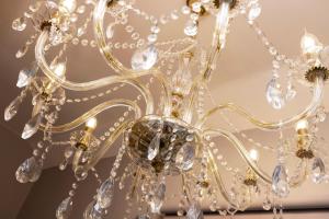 a close up of a chandelier at Stylish George Street Apartment in Peebles