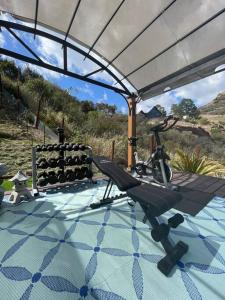 a gym with a chair and a swimming pool at Quiet Mountain Vineyard Above the Clouds in Malibu
