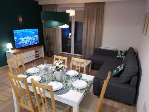 TV in/ali zabaviščno središče v nastanitvi APARTAMENT ADAMENTIS LUBAWA