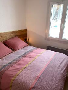 Postelja oz. postelje v sobi nastanitve La cabane du Mont de L'Herba