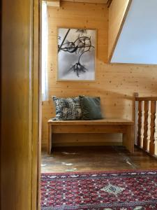 a wooden room with a bench in a cabin at Chalet Pironnet with BEST Views, Charm and Comfort! in Lauterbrunnen
