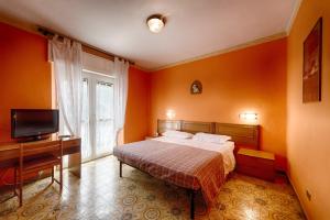 TV a/nebo společenská místnost v ubytování Albergo Mancuso del Voison