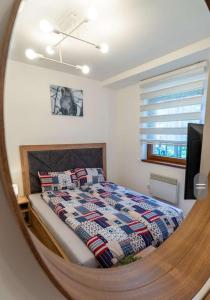 Ένα ή περισσότερα κρεβάτια σε δωμάτιο στο Apartman Pavle