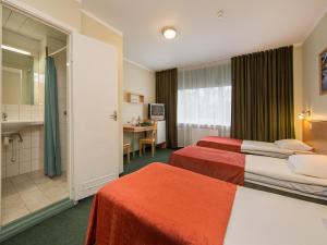 Voodi või voodid majutusasutuse Arabella Hotel toas