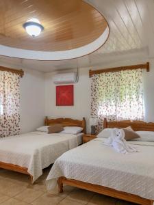 Postel nebo postele na pokoji v ubytování Hostal Familiar Rolo