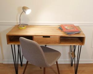 a desk with a chair and a lamp and a book at Cozy Condo near Buckhead in Atlanta