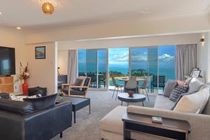 a large living room with a view of the ocean at Ocean Vista in Nelson